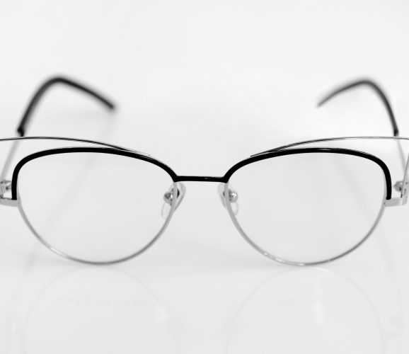 Eye glasses with clear lenses on the white background