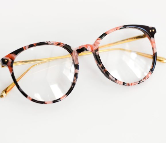 Female fashion glasses on white background